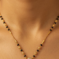 Elegantly Crafted Diamond-Accent Teardrop Mangalsutra in Gold and Black Beads