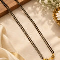 Classic Double-Strand Black Bead Mangalsutra with Textured Gold & Stone-Studded Ball Pendant