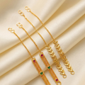 Elegant Gold-Plated Ear Support Chains with Leaf and Gemstone Motifs