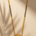 Gold-Plated Mangalsutra with Goddess Lakshmi Round Pendant and Black Beaded Double Chain Long Mangalsutra for Women